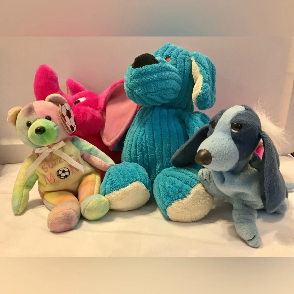 4 stuffed animals: blue dogs, hot pink elephant dog & soccer mom multicolor bear